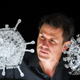 Artist Luke Jerram with his glass sculpture of the Oxford-AstraZeneca coronavirus vaccine, left, alongside his earlier work of the virus itself, in glass at the Paintworks on February 05, 2021 in Bristol, England.